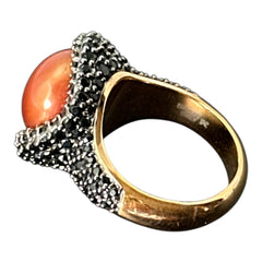 Vintage Honora Italy bronze ring featuring a 12.5mm orange cultured pearl surrounded by faceted black spinel; warm-toned statement jewelry with autumnal elegance and sculptural detail.