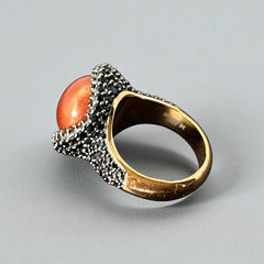 Vintage Honora Italy bronze ring featuring a 12.5mm orange cultured pearl surrounded by faceted black spinel; warm-toned statement jewelry with autumnal elegance and sculptural detail.