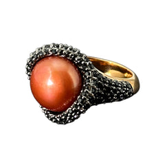 Vintage Honora Italy bronze ring featuring a 12.5mm orange cultured pearl surrounded by faceted black spinel; warm-toned statement jewelry with autumnal elegance and sculptural detail.