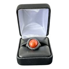 Vintage Honora Italy bronze ring featuring a 12.5mm orange cultured pearl surrounded by faceted black spinel; warm-toned statement jewelry with autumnal elegance and sculptural detail.