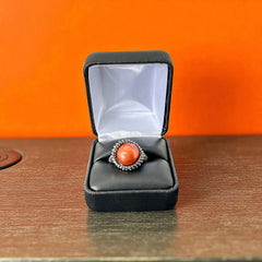 Vintage Honora Italy bronze ring featuring a 12.5mm orange cultured pearl surrounded by faceted black spinel; warm-toned statement jewelry with autumnal elegance and sculptural detail.