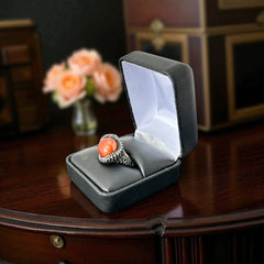Vintage Honora Italy bronze ring featuring a 12.5mm orange cultured pearl surrounded by faceted black spinel; warm-toned statement jewelry with autumnal elegance and sculptural detail.