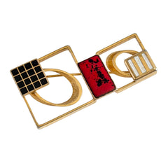 Vintage geometric modernist brooch with red, black, and white enamel in gold‑tone metal.