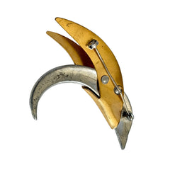 Vintage modernist bird brooch in gold and silver tone with pavé rhinestones and black enamel details.