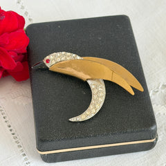 Vintage modernist bird brooch in gold and silver tone with pavé rhinestones and black enamel details.
