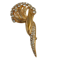 Vintage Monet gold tone brooch with pave rhinestones in a stylized floral umbel design.