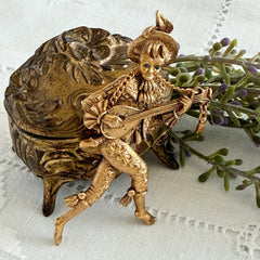 Vintage Monet gold tone minstrel brooch with blue rhinestones, 1960s signed © Monet figural jester