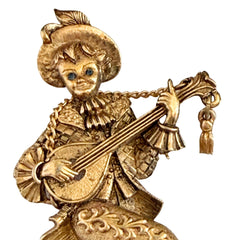 Vintage Monet gold tone minstrel brooch with blue rhinestones, 1960s signed © Monet figural jester