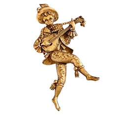 Vintage Monet gold tone minstrel brooch with blue rhinestones, 1960s signed © Monet figural jester