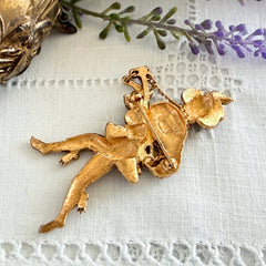Vintage Monet gold tone minstrel brooch with blue rhinestones, 1960s signed © Monet figural jester