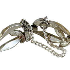 Vintage Monet modernist floral silver‑tone bracelet with sculptural polished links, signed clasp and © Monet hang tag