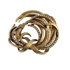 Vintage Monet textured gold tone swirl brooch with pave rhinestones, 1960s signed piece.