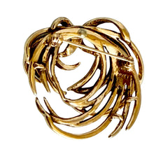 Vintage Monet textured gold tone swirl brooch with pave rhinestones, 1960s signed piece.
