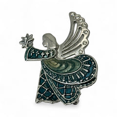 Vintage Monet angel brooch in silver tone metal with teal and light green enamel robe, clear rhinestone wings, and raised star detail; signed Monet on back.