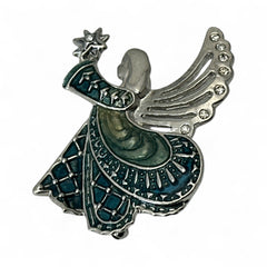 Vintage Monet angel brooch in silver tone metal with teal and light green enamel robe, clear rhinestone wings, and raised star detail; signed Monet on back.