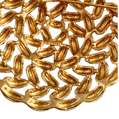 Vintage 1960s Monet braided gold‑tone rope brooch with textured sculptural design. Large 2¼" round statement pin in excellent condition, signed Monet.