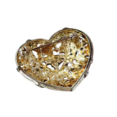 Vintage heart brooch with Montana sapphire and clear rhinestones in silver‑tone metal with gold wash, displayed on lace with a green book and pink flower