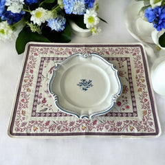 Provence Jacquard Montespan Collection placemat from Tissus Toselli, featuring a pink floral design on a cream-colored background, woven with intricate patterns inspired by old Provencal fabrics, measuring 19" x 15", photographed showcasing its elegant and refined craftsmanship