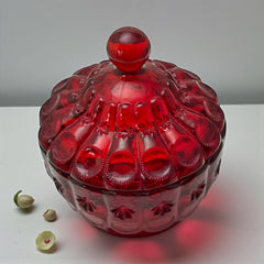 Vintage Moon and Stars ruby red glass candy dish with scalloped bowl and matching lid, featuring embossed celestial motifs and rich translucent color.