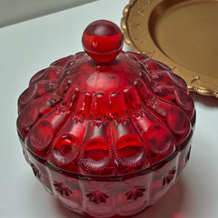 Vintage Moon and Stars ruby red glass candy dish with scalloped bowl and matching lid, featuring embossed celestial motifs and rich translucent color.