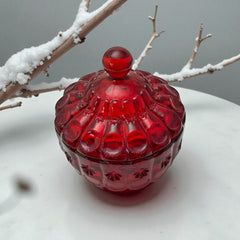 Vintage Moon and Stars ruby red glass candy dish with scalloped bowl and matching lid, featuring embossed celestial motifs and rich translucent color.