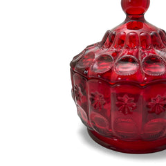 Vintage Moon and Stars ruby red glass candy dish with scalloped bowl and matching lid, featuring embossed celestial motifs and rich translucent color.