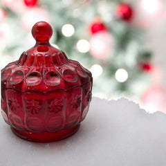 Vintage Moon and Stars ruby red glass candy dish with scalloped bowl and matching lid, featuring embossed celestial motifs and rich translucent color.