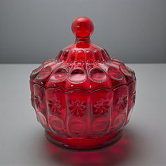 Vintage Moon and Stars ruby red glass candy dish with scalloped bowl and matching lid, featuring embossed celestial motifs and rich translucent color.