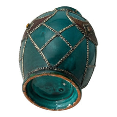 Vintage Moroccan round vase with green glaze, featuring geometric metal decor, four dyed leather inlays with yellow or red bezel-set glass cabochons at their center, and triangle-shaped leather accents around the top, from the 1970s/80s in very good condition.