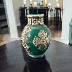 Vintage Moroccan small vase from the 1970s or 1980s, featuring a green glaze with ornate metal overlay in floral and geometric patterns, very good condition.