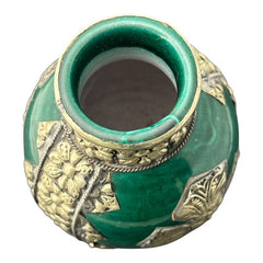 Vintage Moroccan small vase from the 1970s or 1980s, featuring a green glaze with ornate metal overlay in floral and geometric patterns, very good condition.