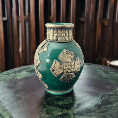 Vintage Moroccan small vase from the 1970s or 1980s, featuring a green glaze with ornate metal overlay in floral and geometric patterns, very good condition.