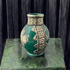 Vintage Moroccan small vase from the 1970s or 1980s, featuring a green glaze with ornate metal overlay in floral and geometric patterns, very good condition.