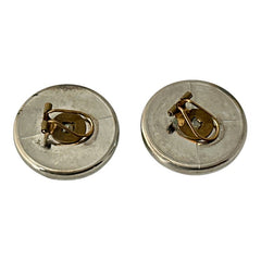 Vintage French button earrings featuring moss green marbled plastic cabochons set in silver tone borders. A classy and elegant 1970s design with retro charm, perfect for sustainable and eco-conscious fashion lovers.