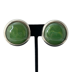 Vintage French button earrings featuring moss green marbled plastic cabochons set in silver tone borders. A classy and elegant 1970s design with retro charm, perfect for sustainable and eco-conscious fashion lovers.