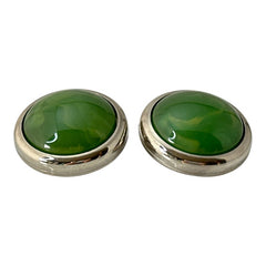 Vintage French button earrings featuring moss green marbled plastic cabochons set in silver tone borders. A classy and elegant 1970s design with retro charm, perfect for sustainable and eco-conscious fashion lovers.