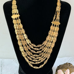 Vintage multi‑strand filigree gold‑tone bib necklace with ornate oval links and adjustable hook clasp.
