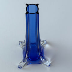 Vintage cobalt blue and clear glass vase with sculptural pulled base and triangular rim, shown from multiple angles.
