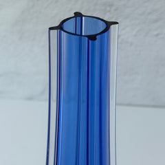 Vintage cobalt blue and clear glass vase with sculptural pulled base and triangular rim, shown from multiple angles.