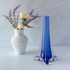 Vintage cobalt blue and clear glass vase with sculptural pulled base and triangular rim, shown from multiple angles.