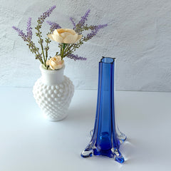 Vintage cobalt blue and clear glass vase with sculptural pulled base and triangular rim, shown from multiple angles.