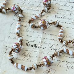 Vintage Venetian Murano glass long necklace with white Fiorato wedding cake beads and copper foil swirl cylinders. Hand‑knotted, 1950s craftsmanship, exquisite detail, and timeless Venetian artistry.