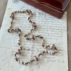 Vintage Venetian Murano glass long necklace with white Fiorato wedding cake beads and copper foil swirl cylinders. Hand‑knotted, 1950s craftsmanship, exquisite detail, and timeless Venetian artistry.