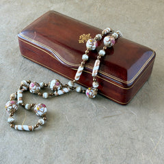 Vintage Venetian Murano glass long necklace with white Fiorato wedding cake beads and copper foil swirl cylinders. Hand‑knotted, 1950s craftsmanship, exquisite detail, and timeless Venetian artistry.