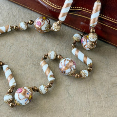 Vintage Venetian Murano glass long necklace with white Fiorato wedding cake beads and copper foil swirl cylinders. Hand‑knotted, 1950s craftsmanship, exquisite detail, and timeless Venetian artistry.