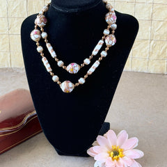 Vintage Venetian Murano glass long necklace with white Fiorato wedding cake beads and copper foil swirl cylinders. Hand‑knotted, 1950s craftsmanship, exquisite detail, and timeless Venetian artistry.