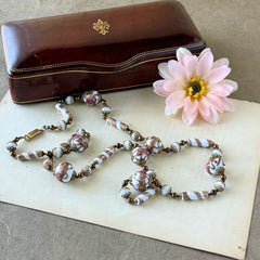 Vintage Venetian Murano glass long necklace with white Fiorato wedding cake beads and copper foil swirl cylinders. Hand‑knotted, 1950s craftsmanship, exquisite detail, and timeless Venetian artistry.