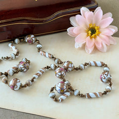 Vintage Venetian Murano glass long necklace with white Fiorato wedding cake beads and copper foil swirl cylinders. Hand‑knotted, 1950s craftsmanship, exquisite detail, and timeless Venetian artistry.