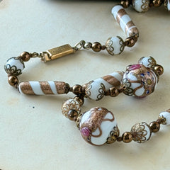 Vintage Venetian Murano glass long necklace with white Fiorato wedding cake beads and copper foil swirl cylinders. Hand‑knotted, 1950s craftsmanship, exquisite detail, and timeless Venetian artistry.