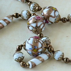 Vintage Venetian Murano glass long necklace with white Fiorato wedding cake beads and copper foil swirl cylinders. Hand‑knotted, 1950s craftsmanship, exquisite detail, and timeless Venetian artistry.